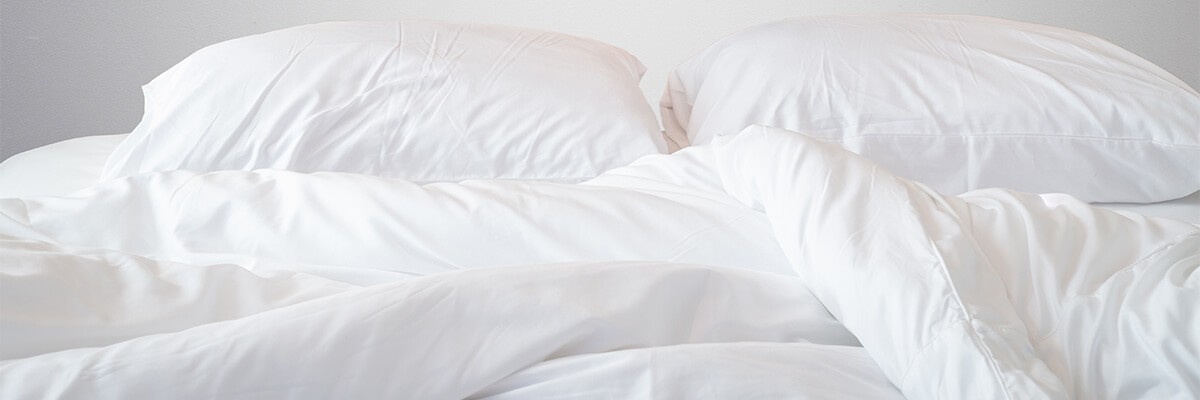 冬でも室温が高めの寝室で、快適に眠るための羽毛布団の選び方